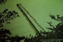 Looking down bluff towards pier in lake